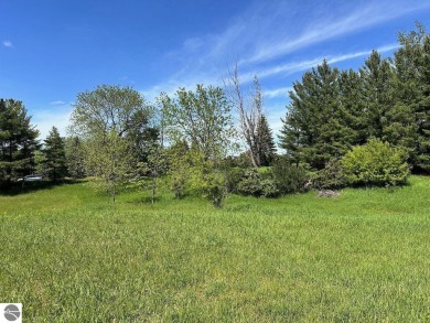 Beautiful, and lightly treed, lot overlooks the 4th fairway at on Shanty Creek Golf Course in Michigan - for sale on GolfHomes.com, golf home, golf lot