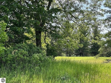 Beautiful, and lightly treed, lot overlooks the 4th fairway at on Shanty Creek Golf Course in Michigan - for sale on GolfHomes.com, golf home, golf lot