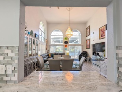 Enjoy this Beautiful two-story pool home, in the private and on The Grand Club - Pine Lakes Course in Florida - for sale on GolfHomes.com, golf home, golf lot