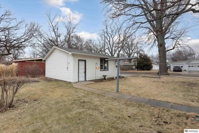 Welcome to this charming 3 bedroom, 3 stall garage home on Jim Ager Memorial Junior Golf Course in Nebraska - for sale on GolfHomes.com, golf home, golf lot