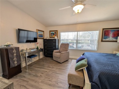 Enjoy this Beautiful two-story pool home, in the private and on The Grand Club - Pine Lakes Course in Florida - for sale on GolfHomes.com, golf home, golf lot