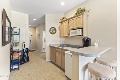 An inviting, fully furnished, 2 bedroom 2 bathroom condo is now on Sea Trail Golf Resort in North Carolina - for sale on GolfHomes.com, golf home, golf lot