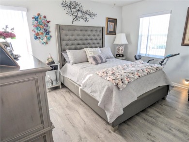 Enjoy this Beautiful two-story pool home, in the private and on The Grand Club - Pine Lakes Course in Florida - for sale on GolfHomes.com, golf home, golf lot