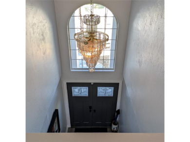 Enjoy this Beautiful two-story pool home, in the private and on The Grand Club - Pine Lakes Course in Florida - for sale on GolfHomes.com, golf home, golf lot