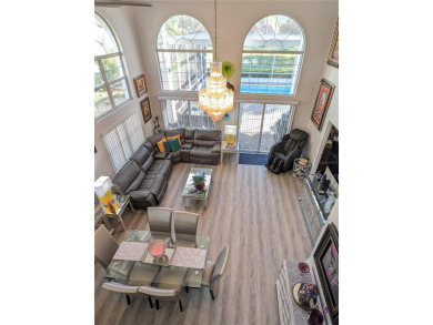 Enjoy this Beautiful two-story pool home, in the private and on The Grand Club - Pine Lakes Course in Florida - for sale on GolfHomes.com, golf home, golf lot