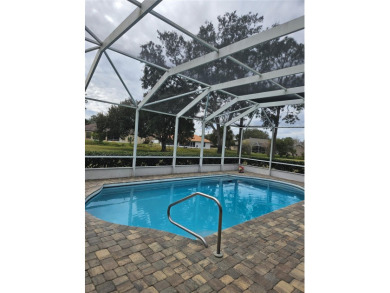 Enjoy this Beautiful two-story pool home, in the private and on The Grand Club - Pine Lakes Course in Florida - for sale on GolfHomes.com, golf home, golf lot