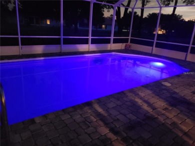 Enjoy this Beautiful two-story pool home, in the private and on The Grand Club - Pine Lakes Course in Florida - for sale on GolfHomes.com, golf home, golf lot
