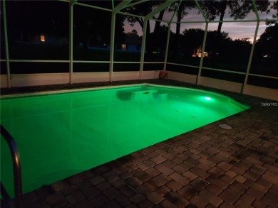 Enjoy this Beautiful two-story pool home, in the private and on The Grand Club - Pine Lakes Course in Florida - for sale on GolfHomes.com, golf home, golf lot