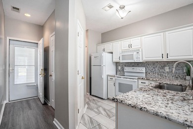 Welcome home to this beautifully updated 2 bedroom, 2 bath first on River Oaks Golf Plantation  in South Carolina - for sale on GolfHomes.com, golf home, golf lot