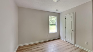 This renovated 3 bedroom, 2 bathroom home offers modern living on Mystery Valley Golf Course in Georgia - for sale on GolfHomes.com, golf home, golf lot