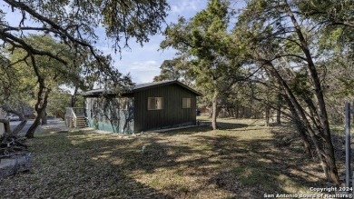 Nestled in a serene setting, this classic rustic home in the on Canyon Lake Golf Club in Texas - for sale on GolfHomes.com, golf home, golf lot