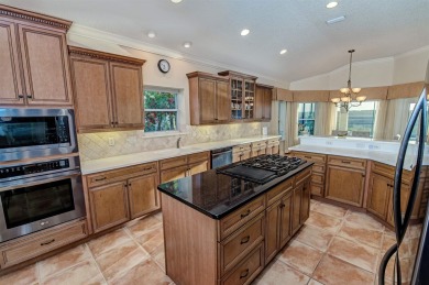 Discover The Perfect Blend Of Luxury  Comfort In This Stunning on Marsh Creek Country Club in Florida - for sale on GolfHomes.com, golf home, golf lot