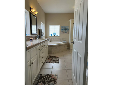 Enjoy resort-style living in this beautifully maintained on The Riverside Golf Club in Florida - for sale on GolfHomes.com, golf home, golf lot