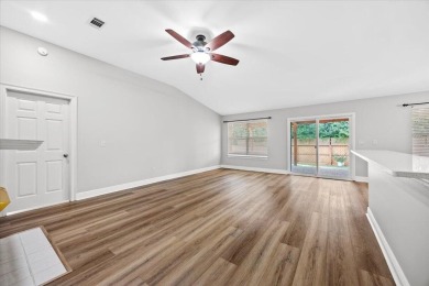 This must-see all brick home is nestled in the sought-after on Fairway Oaks at Magnolia Golf Course in Florida - for sale on GolfHomes.com, golf home, golf lot