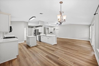 This must-see all brick home is nestled in the sought-after on Fairway Oaks at Magnolia Golf Course in Florida - for sale on GolfHomes.com, golf home, golf lot