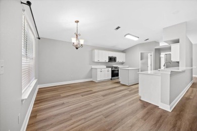 This must-see all brick home is nestled in the sought-after on Fairway Oaks at Magnolia Golf Course in Florida - for sale on GolfHomes.com, golf home, golf lot