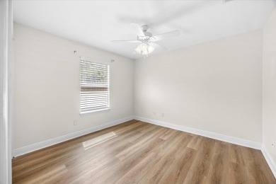 This must-see all brick home is nestled in the sought-after on Fairway Oaks at Magnolia Golf Course in Florida - for sale on GolfHomes.com, golf home, golf lot