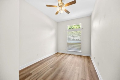 This must-see all brick home is nestled in the sought-after on Fairway Oaks at Magnolia Golf Course in Florida - for sale on GolfHomes.com, golf home, golf lot