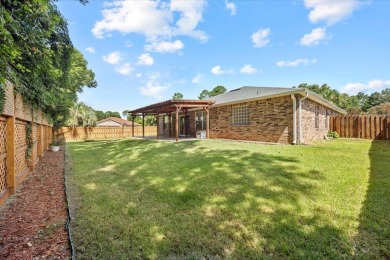 This must-see all brick home is nestled in the sought-after on Fairway Oaks at Magnolia Golf Course in Florida - for sale on GolfHomes.com, golf home, golf lot