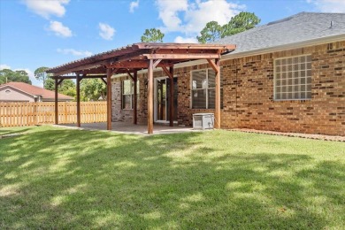 This must-see all brick home is nestled in the sought-after on Fairway Oaks at Magnolia Golf Course in Florida - for sale on GolfHomes.com, golf home, golf lot
