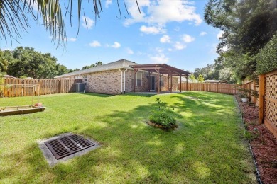 This must-see all brick home is nestled in the sought-after on Fairway Oaks at Magnolia Golf Course in Florida - for sale on GolfHomes.com, golf home, golf lot