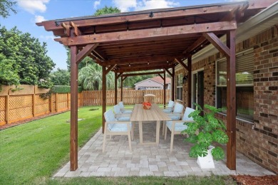 This must-see all brick home is nestled in the sought-after on Fairway Oaks at Magnolia Golf Course in Florida - for sale on GolfHomes.com, golf home, golf lot