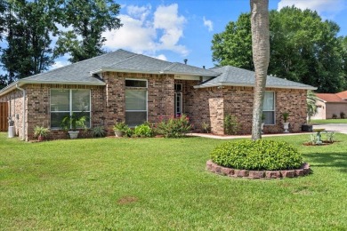 This must-see all brick home is nestled in the sought-after on Fairway Oaks at Magnolia Golf Course in Florida - for sale on GolfHomes.com, golf home, golf lot
