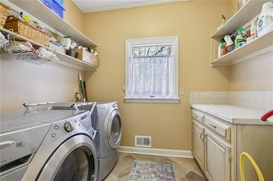 Tucked away on a quiet circle in Atlanta Country Clubs back nine on Atlanta Country Club in Georgia - for sale on GolfHomes.com, golf home, golf lot