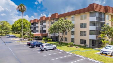 You're invited to this 2/2 corner unit with large windows on Inverrary Country Club in Florida - for sale on GolfHomes.com, golf home, golf lot