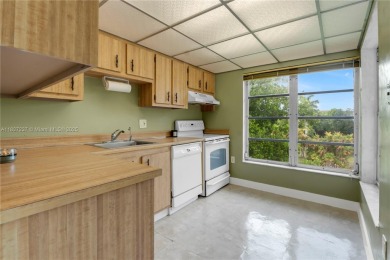 You're invited to this 2/2 corner unit with large windows on Inverrary Country Club in Florida - for sale on GolfHomes.com, golf home, golf lot