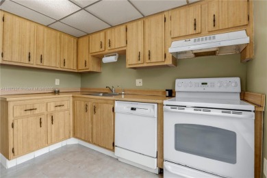 You're invited to this 2/2 corner unit with large windows on Inverrary Country Club in Florida - for sale on GolfHomes.com, golf home, golf lot