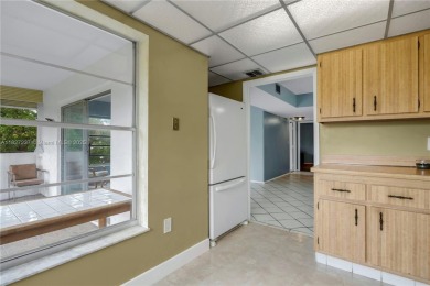 You're invited to this 2/2 corner unit with large windows on Inverrary Country Club in Florida - for sale on GolfHomes.com, golf home, golf lot