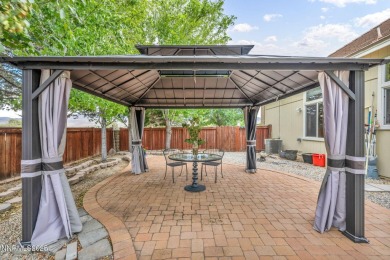 Stunning two-story home situated on the 15th green at Dayton on Dayton Valley Golf Club At Legado in Nevada - for sale on GolfHomes.com, golf home, golf lot