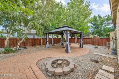 Stunning two-story home situated on the 15th green at Dayton on Dayton Valley Golf Club At Legado in Nevada - for sale on GolfHomes.com, golf home, golf lot