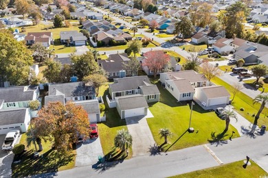Beautifully updated 2-bedroom, 2-bath home in the desirable on Island Green Golf Club in South Carolina - for sale on GolfHomes.com, golf home, golf lot