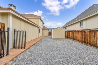 Stunning two-story home situated on the 15th green at Dayton on Dayton Valley Golf Club At Legado in Nevada - for sale on GolfHomes.com, golf home, golf lot