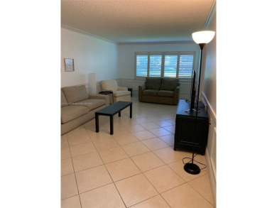 Beautiful first floor end unit. 3 beds, 2 baths with a view to on Wynmoor Golf Course in Florida - for sale on GolfHomes.com, golf home, golf lot