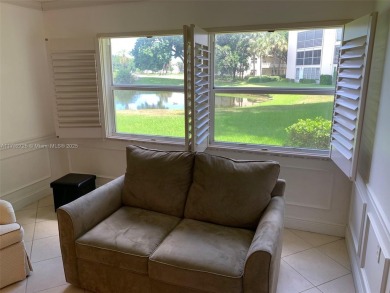 Beautiful first floor end unit. 3 beds, 2 baths with a view to on Wynmoor Golf Course in Florida - for sale on GolfHomes.com, golf home, golf lot