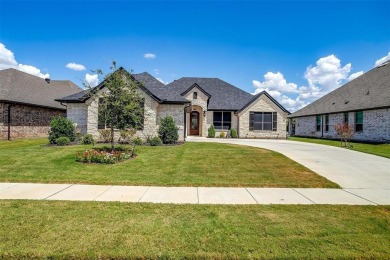 From the moment you approach the driveway, this home in the on Harbor Lakes Golf Club in Texas - for sale on GolfHomes.com, golf home, golf lot