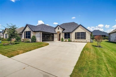 From the moment you approach the driveway, this home in the on Harbor Lakes Golf Club in Texas - for sale on GolfHomes.com, golf home, golf lot