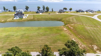 Set your home against peaceful pond views in gated Occano. This on Occano Golf Course in North Carolina - for sale on GolfHomes.com, golf home, golf lot