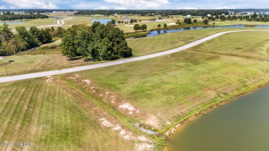 Set your home against peaceful pond views in gated Occano. This on Occano Golf Course in North Carolina - for sale on GolfHomes.com, golf home, golf lot