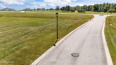 Set your home against peaceful pond views in gated Occano. This on Occano Golf Course in North Carolina - for sale on GolfHomes.com, golf home, golf lot