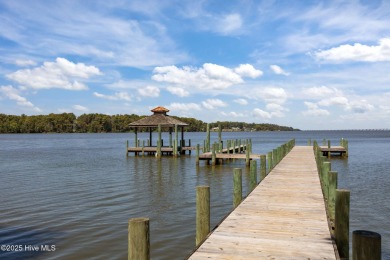 Set your home against peaceful pond views in gated Occano. This on Occano Golf Course in North Carolina - for sale on GolfHomes.com, golf home, golf lot