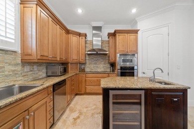 This exquisite custom home, nestled in the secure and golf on Regatta Bay Golf and Country Club in Florida - for sale on GolfHomes.com, golf home, golf lot