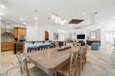This exquisite custom home, nestled in the secure and golf on Regatta Bay Golf and Country Club in Florida - for sale on GolfHomes.com, golf home, golf lot
