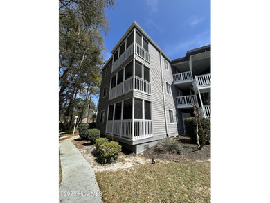 Welcome to this charming 2-bedroom, 2-bathroom coastal condo on Carolina Shores Golf Course in North Carolina - for sale on GolfHomes.com, golf home, golf lot
