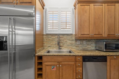 This exquisite custom home, nestled in the secure and golf on Regatta Bay Golf and Country Club in Florida - for sale on GolfHomes.com, golf home, golf lot