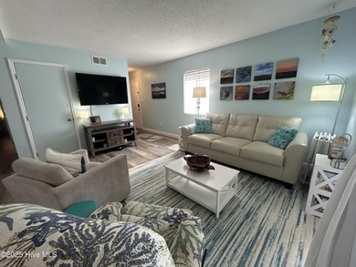 Welcome to this charming 2-bedroom, 2-bathroom coastal condo on Carolina Shores Golf Course in North Carolina - for sale on GolfHomes.com, golf home, golf lot