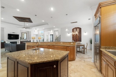 This exquisite custom home, nestled in the secure and golf on Regatta Bay Golf and Country Club in Florida - for sale on GolfHomes.com, golf home, golf lot